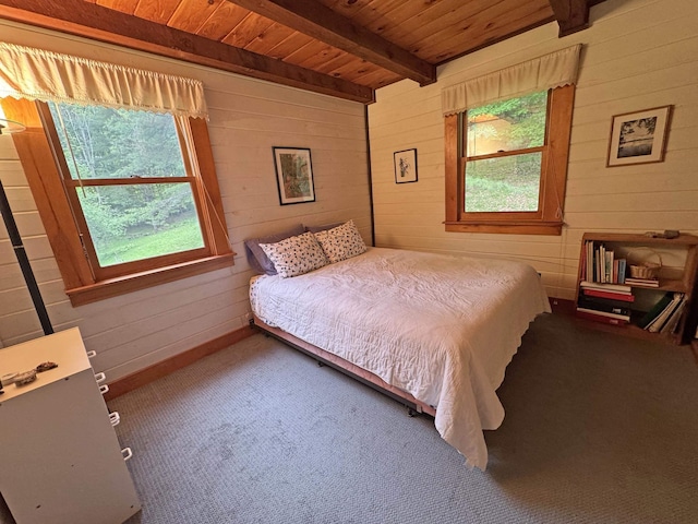 32 Christie Ln, Brattleboro, VT 05301 - bedroom featuring wood walls, wood ceiling with exposed beams, and carpet