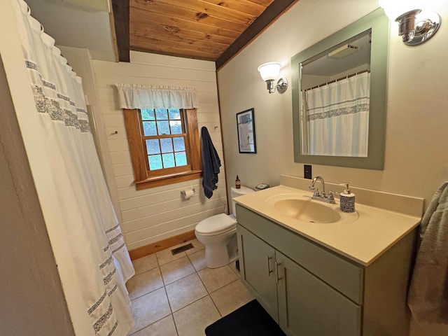32 Christie Ln, Brattleboro, VT 05301 - full bathroom featuring wood ceiling with exposed beams, toilet, vanity, tile patterned floors, and baseboards
