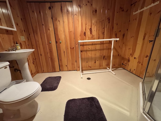 32 Christie Ln, Brattleboro, VT 05301 - bathroom with wood walls, toilet, and an enclosed shower