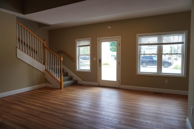 21 E Pearl St, Nashua, NH 03060 - entrance foyer with wood finished floors, stairs, and baseboards