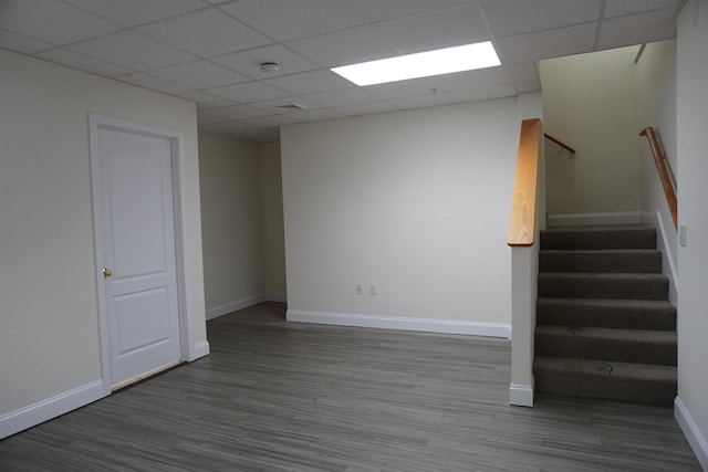 21 E Pearl St, Nashua, NH 03060 - empty room with wood finished floors, baseboards, a paneled ceiling, stairs, and a smoke detector