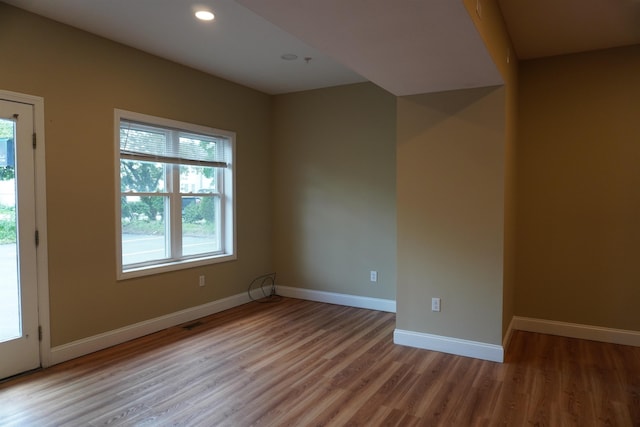 21 E Pearl St, Nashua, NH 03060 - spare room with plenty of natural light, wood finished floors, baseboards, and recessed lighting