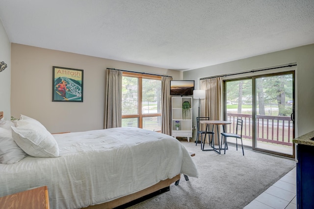 1-O River Run Rd Unit 0, Bartlett, NH 03812 - bedroom featuring access to outside and a textured ceiling