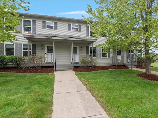 8 Checkerberry Sq Unit 106, Milton, VT 05468 - townhome / multi-family property featuring a front yard and a porch