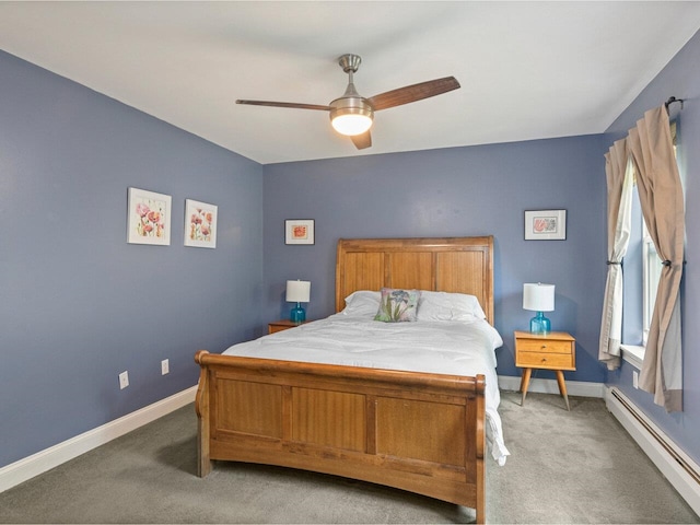 8 Checkerberry Sq Unit 106, Milton, VT 05468 - bedroom with baseboard heating, light carpet, baseboards, and ceiling fan