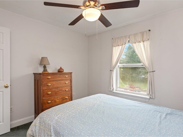 8 Checkerberry Sq Unit 106, Milton, VT 05468 - bedroom featuring baseboards, dark carpet, and ceiling fan