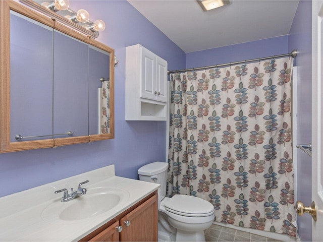 8 Checkerberry Sq Unit 106, Milton, VT 05468 - full bathroom featuring vanity, toilet, a shower with shower curtain, and tile patterned flooring