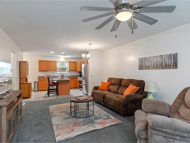8 Checkerberry Sq Unit 106, Milton, VT 05468 - living area featuring ceiling fan, a chandelier, and light carpet