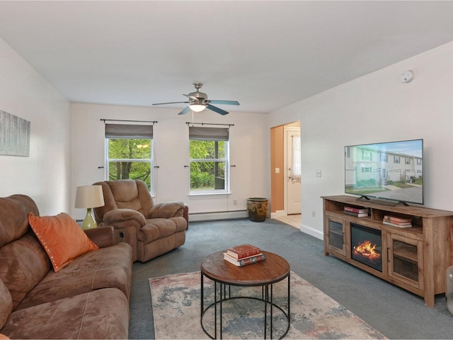 8 Checkerberry Sq Unit 106, Milton, VT 05468 - living room featuring carpet, a baseboard radiator, a ceiling fan, and baseboards