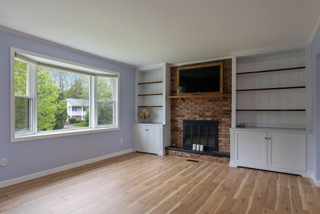 82 Stirrup Cir, Williston, VT 05495 - unfurnished living room with baseboards, healthy amount of natural light, light wood-type flooring, and crown molding