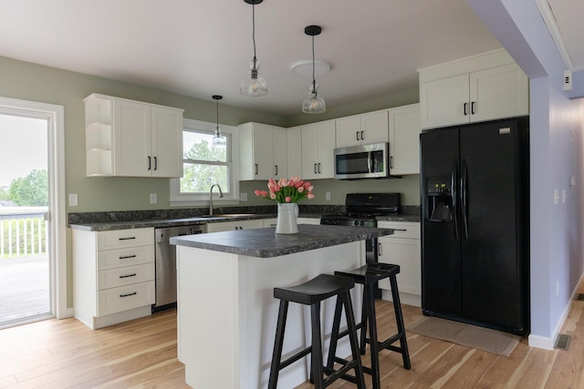 82 Stirrup Cir, Williston, VT 05495 - kitchen featuring appliances with stainless steel finishes, a sink, dark countertops, and light wood-type flooring