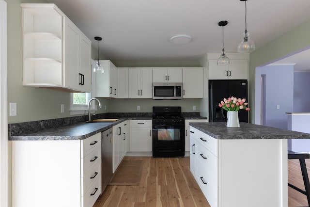 82 Stirrup Cir, Williston, VT 05495 - kitchen with black appliances, a sink, open shelves, dark countertops, and light wood-type flooring
