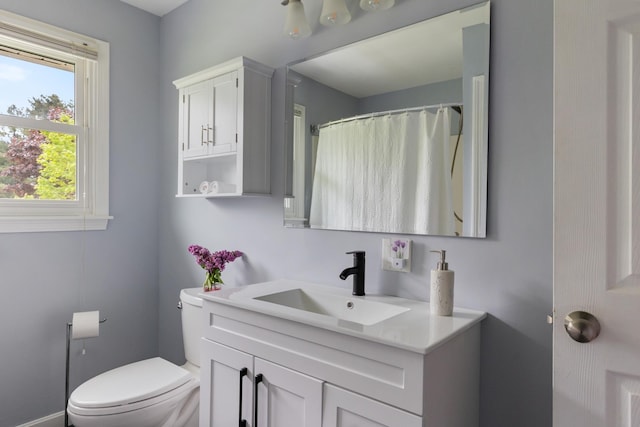 82 Stirrup Cir, Williston, VT 05495 - full bathroom with vanity, toilet, and a shower with shower curtain