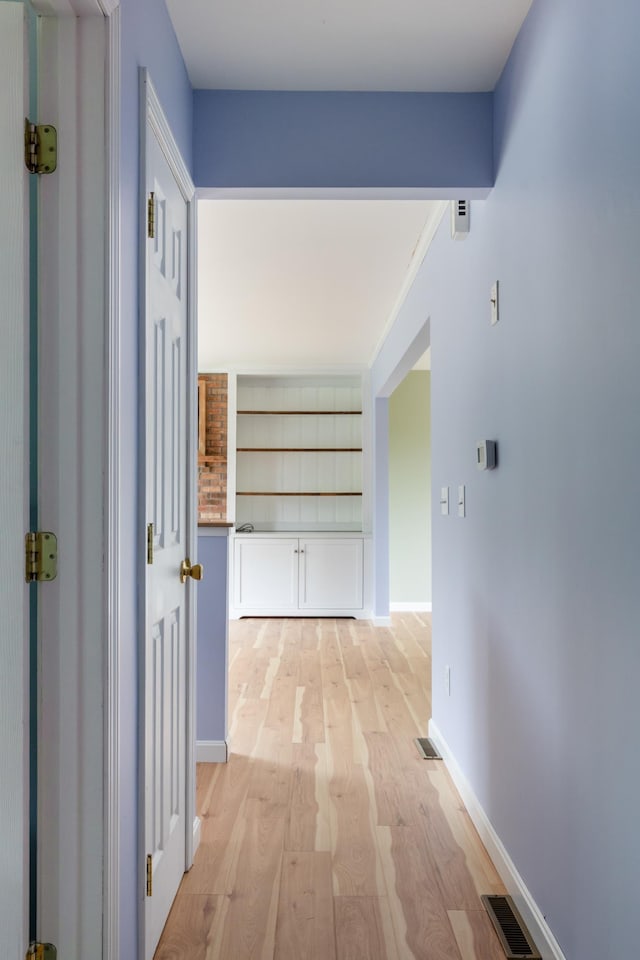 82 Stirrup Cir, Williston, VT 05495 - hallway featuring light wood-type flooring and baseboards
