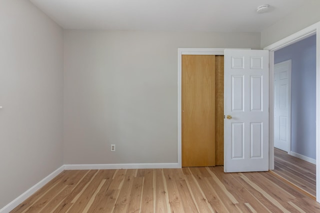 82 Stirrup Cir, Williston, VT 05495 - unfurnished bedroom featuring baseboards, light wood-style floors, and a closet