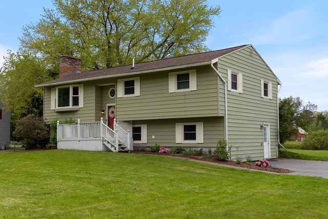82 Stirrup Cir, Williston, VT 05495 - raised ranch featuring a chimney and a front yard