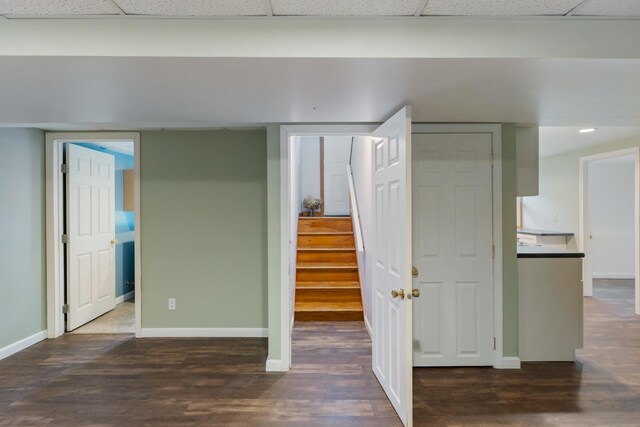 82 Stirrup Cir, Williston, VT 05495 - basement featuring a paneled ceiling, baseboards, wood finished floors, and stairs