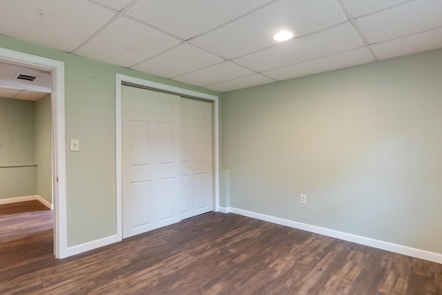 82 Stirrup Cir, Williston, VT 05495 - unfurnished bedroom with dark wood-type flooring, baseboards, a closet, and a drop ceiling