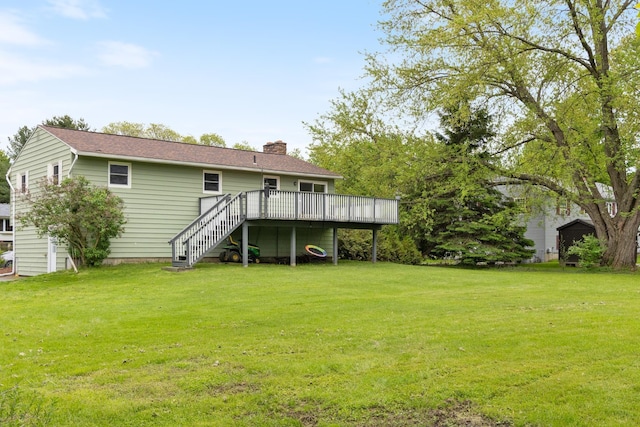 82 Stirrup Cir, Williston, VT 05495 - rear view of house with a wooden deck, a chimney, stairway, a lawn, and a shingled roof