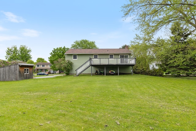 82 Stirrup Cir, Williston, VT 05495 - back of property with a wooden deck, stairs, a lawn, and a chimney