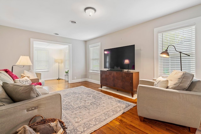 546 Salmon Falls Rd, Rochester, NH 03868 - living room with wood finished floors and baseboards