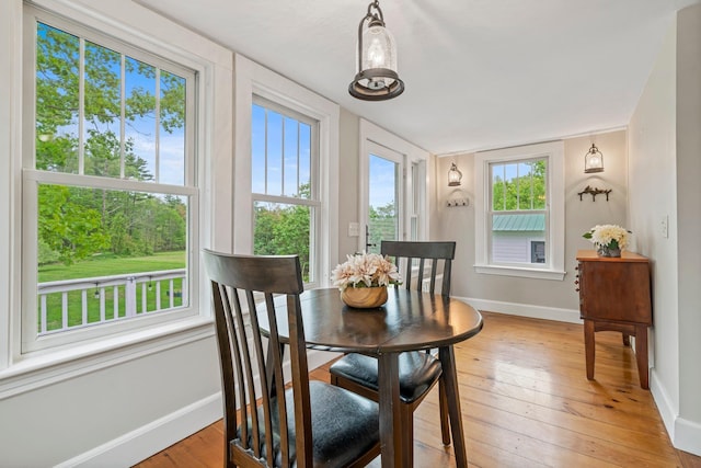 546 Salmon Falls Rd, Rochester, NH 03868 - dining space with baseboards and light wood finished floors