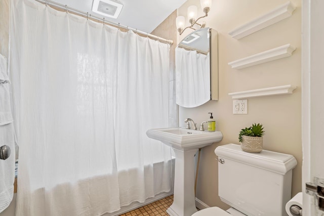 546 Salmon Falls Rd, Rochester, NH 03868 - full bath with toilet, shower / bath combo, tile patterned floors, and a sink