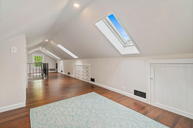 546 Salmon Falls Rd, Rochester, NH 03868 - additional living space featuring a skylight, vaulted ceiling, wood finished floors, and baseboards