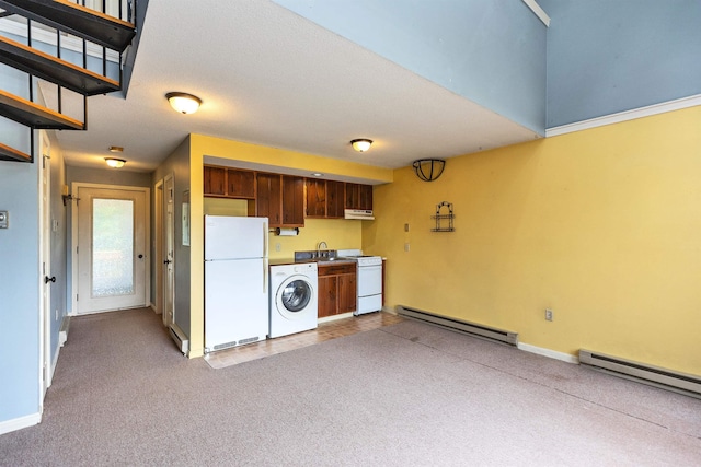 10 Onset Rd Unit 9A, Bennington, NH 03442 - kitchen with white appliances, a baseboard heating unit, washer / dryer, a sink, and carpet