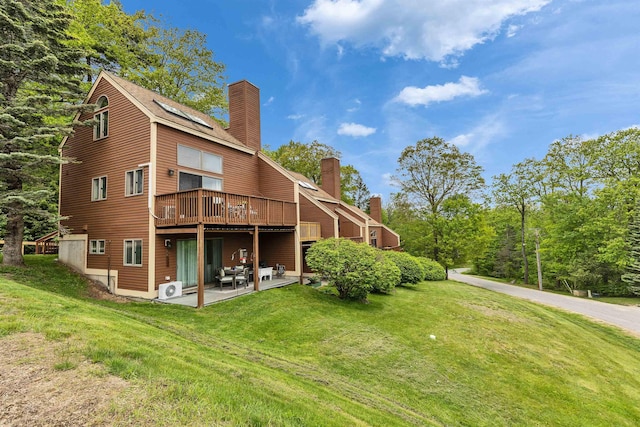 10 Onset Rd Unit 9A, Bennington, NH 03442 - back of property with a chimney, a lawn, and a patio