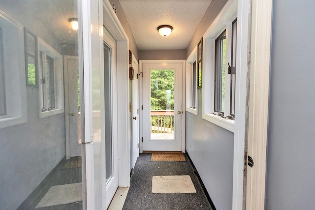 10 Onset Rd Unit 9A, Bennington, NH 03442 - entryway with a textured ceiling and baseboards