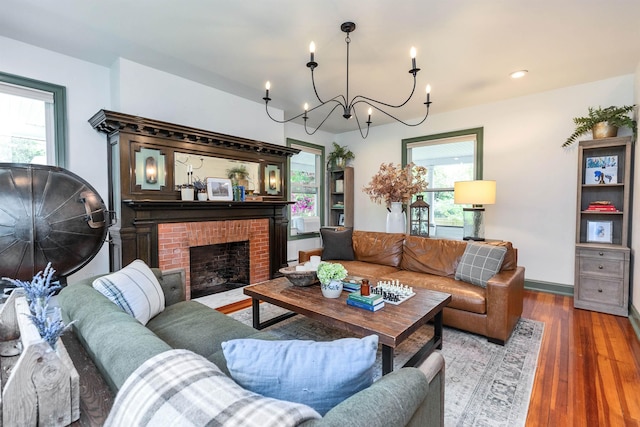 120 S Mast St, Goffstown, NH 03045 - living area featuring a chandelier, wood finished floors, a fireplace, recessed lighting, and baseboards
