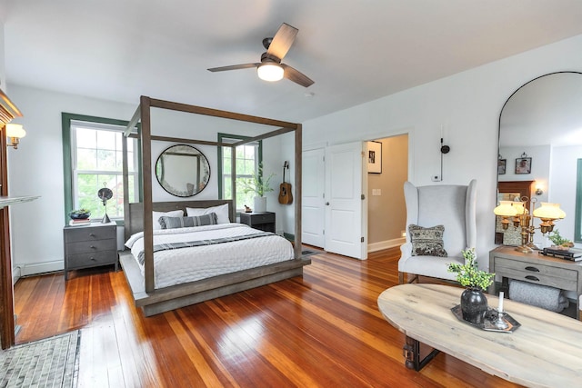 120 S Mast St, Goffstown, NH 03045 - bedroom with a baseboard heating unit, hardwood / wood-style flooring, and ceiling fan