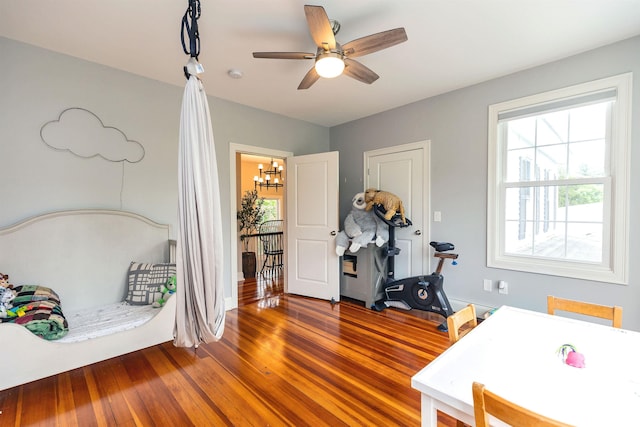 120 S Mast St, Goffstown, NH 03045 - bedroom with wood finished floors, a chandelier, and ceiling fan