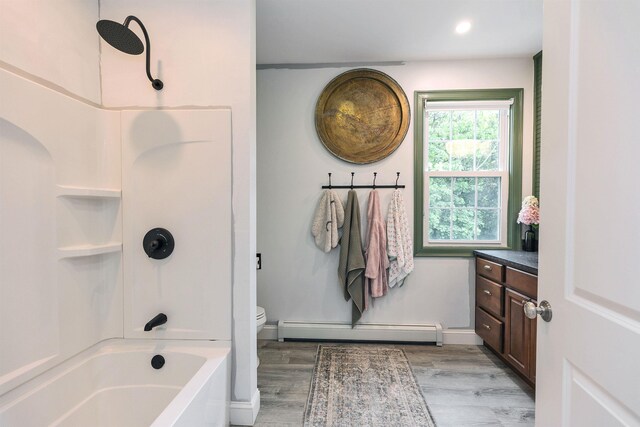 120 S Mast St, Goffstown, NH 03045 - full bath featuring a baseboard radiator, wood finished floors, toilet, shower / bath combination, and recessed lighting