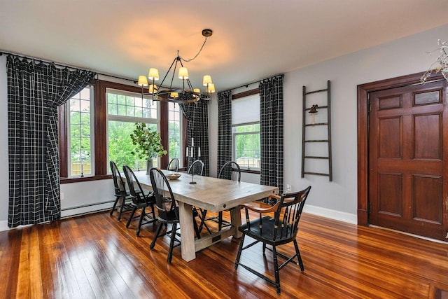 120 S Mast St, Goffstown, NH 03045 - dining space featuring a chandelier, baseboard heating, dark wood-style flooring, and baseboards