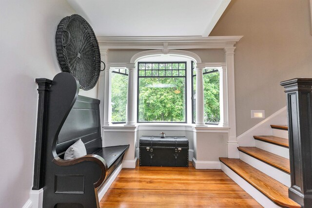 120 S Mast St, Goffstown, NH 03045 - sitting room with ornate columns, light wood-style flooring, stairs, and baseboards