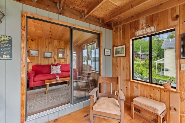 50 Browns Beach Rd, Bristol, NH 03222 - living area featuring wood walls, wood finished floors, and wooden ceiling with exposed beams