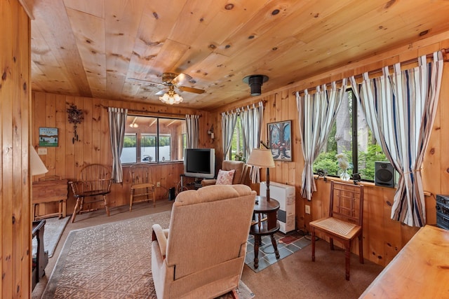 50 Browns Beach Rd, Bristol, NH 03222 - carpeted living room featuring wooden walls, wood ceiling, and ceiling fan