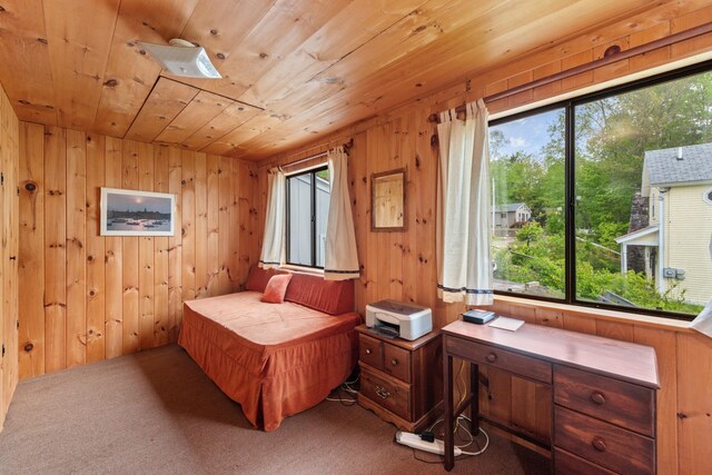 50 Browns Beach Rd, Bristol, NH 03222 - carpeted bedroom with wood ceiling, multiple windows, wooden walls, and a desk