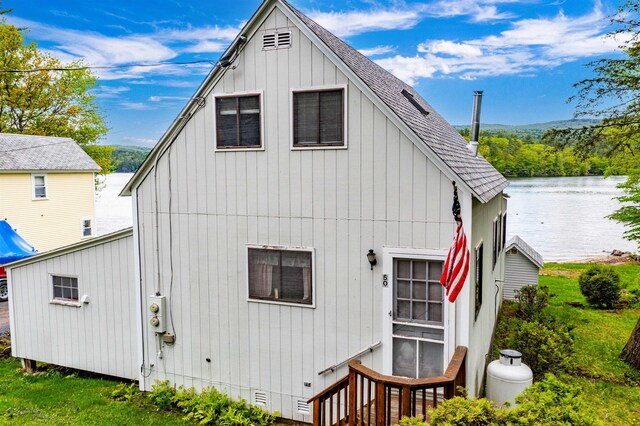 50 Browns Beach Rd, Bristol, NH 03222 - back of property featuring a shingled roof, a water view, and crawl space