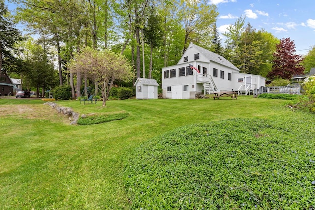 50 Browns Beach Rd, Bristol, NH 03222 - view of grassy yard featuring stairs and view of wooded area
