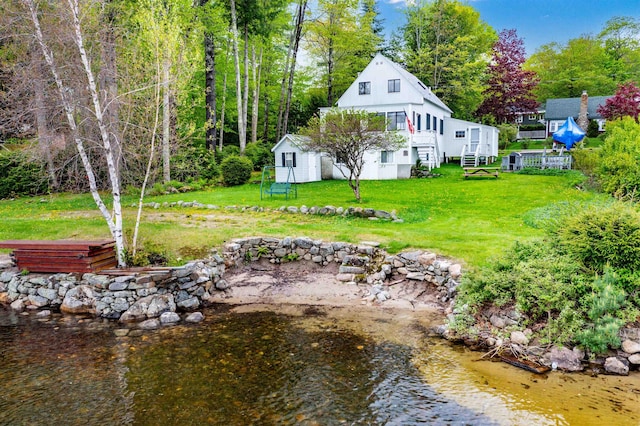 50 Browns Beach Rd, Bristol, NH 03222 - view of grassy yard with an outdoor structure and a deck with water view