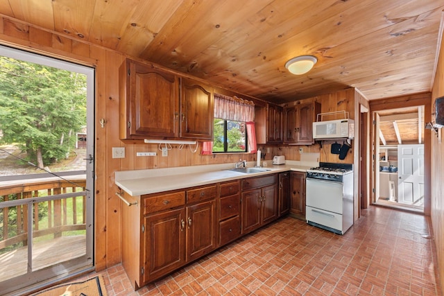 50 Browns Beach Rd, Bristol, NH 03222 - kitchen with white appliances, a sink, brick patterned flooring, wooden ceiling, and light countertops