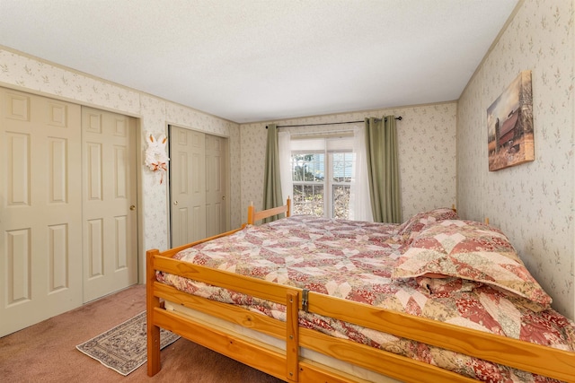 26 Birch Hill Estates Rd, Wolfeboro, NH 03894 - carpeted bedroom with wallpapered walls and two closets
