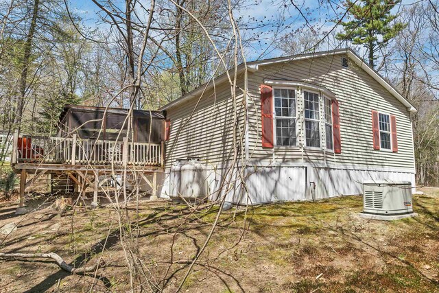 26 Birch Hill Estates Rd, Wolfeboro, NH 03894 - view of home's exterior featuring a sunroom and a wooden deck