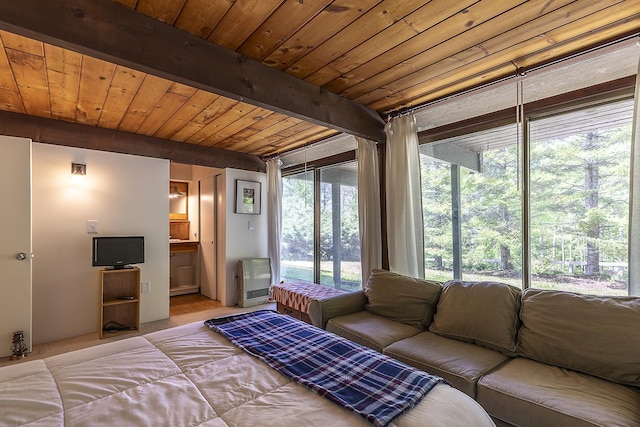 46 Murray Hill Heights Rd Unit 17, Manchester, VT 05255 - bedroom with wooden ceiling with exposed beams, ensuite bath, access to outside, and heating unit