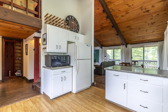 46 Murray Hill Heights Rd Unit 17, Manchester, VT 05255 - kitchen featuring black microwave, freestanding refrigerator, wood ceiling, light wood-type flooring, and white cabinets