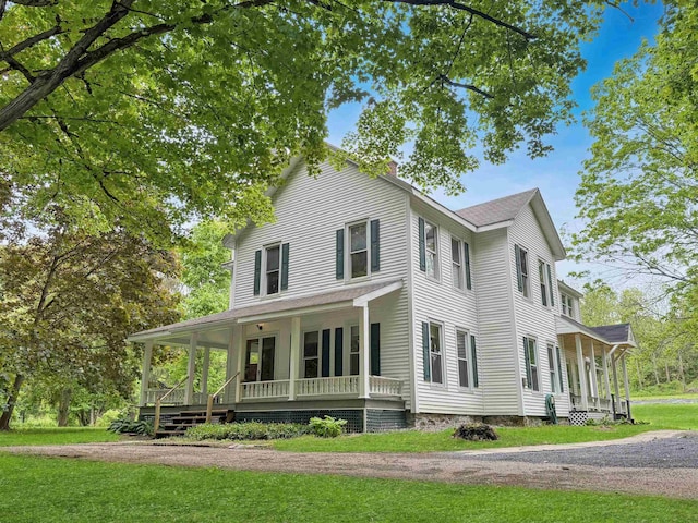 927 Water St, Bennington, VT 05257 - view of front facade with a porch, a front yard, and a shingled roof