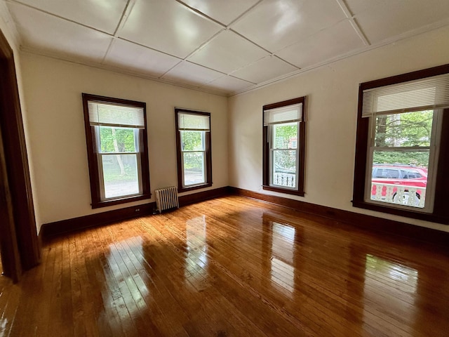 927 Water St, Bennington, VT 05257 - spare room featuring radiator heating unit, wood-type flooring, and baseboards
